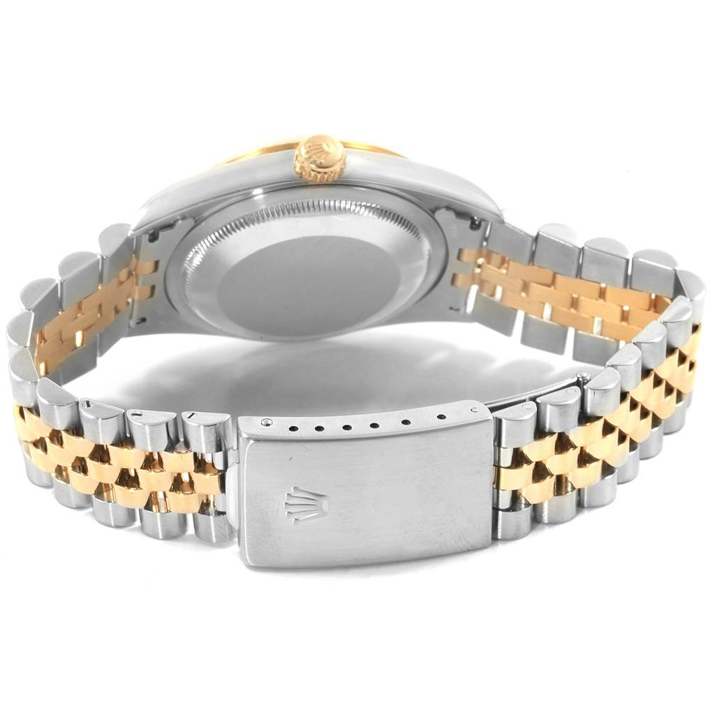 This image shows the back case and the two-tone bracelet of a Rolex Datejust 16233 Men's Steel and Gold (two tone) Grey Dial 16233 Men's Steel and Gold (two tone) Grey Dial watch.