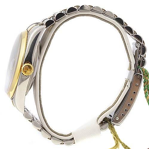 The image shows a side profile of a Rolex Datejust 16203 Men's Stainless Steel Blue Dial 16203 Men's Stainless Steel Blue Dial watch, highlighting its crown, case, and bracelet.