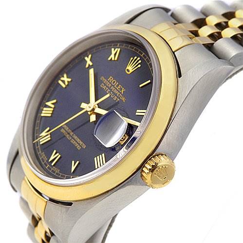 The image shows a Rolex Datejust 16203 Men's Stainless Steel Blue Dial 16203 Men's Stainless Steel Blue Dial watch at an angle highlighting the gold crown, bezel, and face with Roman numerals.