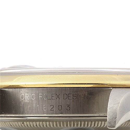 This image shows a close-up of the side of the Rolex Datejust 16203 Men's Stainless Steel Blue Dial 16203 Men's Stainless Steel Blue Dial Model 16203, revealing the "ORG ROLEX DESIGN" engraving.