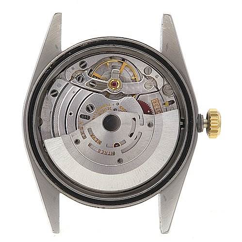 The image shows the internal movement mechanism of a Rolex Datejust 16203 Men's Stainless Steel Blue Dial 16203 Men's Stainless Steel Blue Dial watch, viewed from the back with the case and winding crown visible.