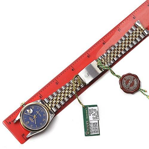 The image shows a Rolex Datejust 16203 Men's Stainless Steel Blue Dial 16203 Men's Stainless Steel Blue Dial watch laid flat with a ruler, displaying the face, bracelet, tags, and seal at an overhead angle.