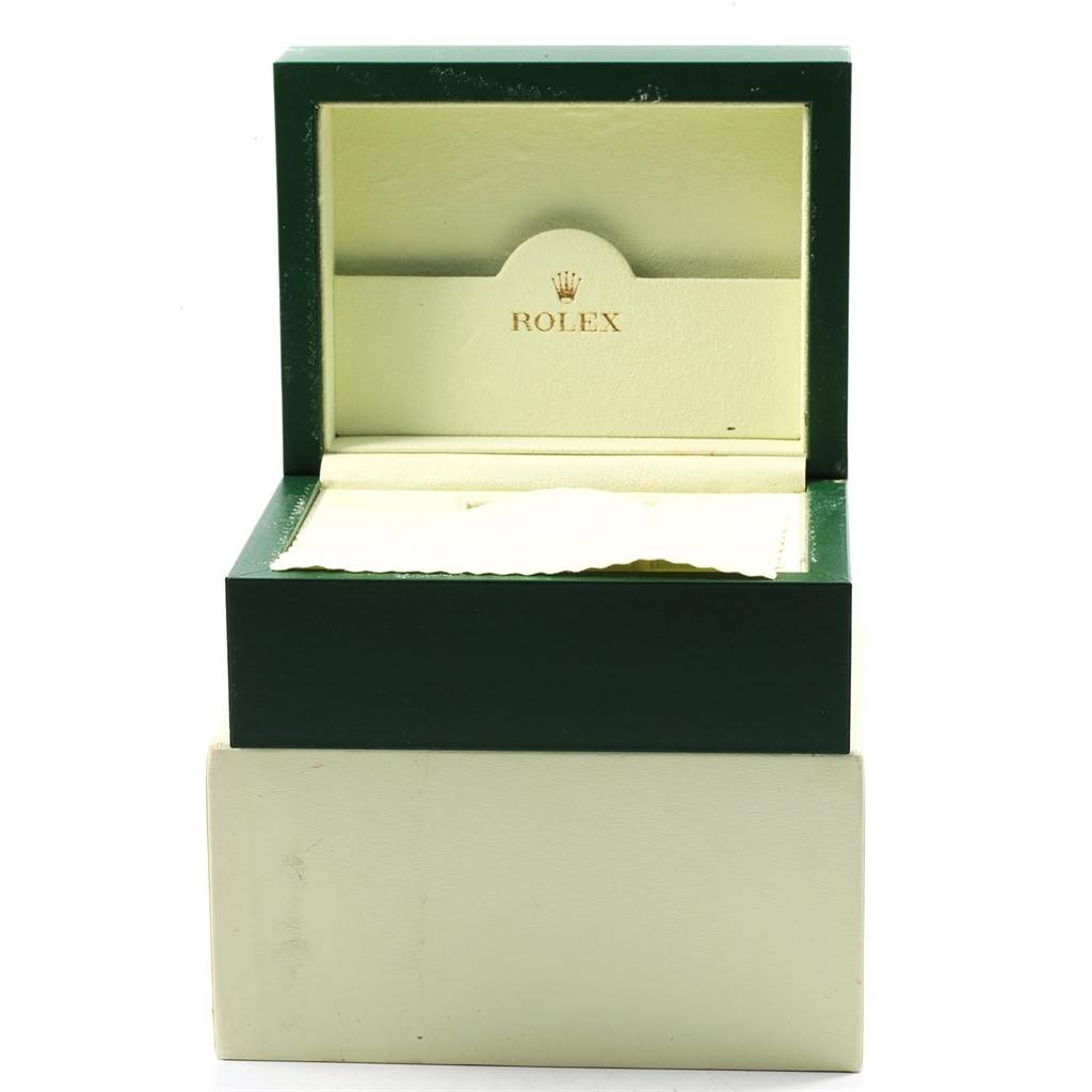 The image shows an open green and cream-colored Rolex box for the Datejust model, without the watch inside, viewed from the front.