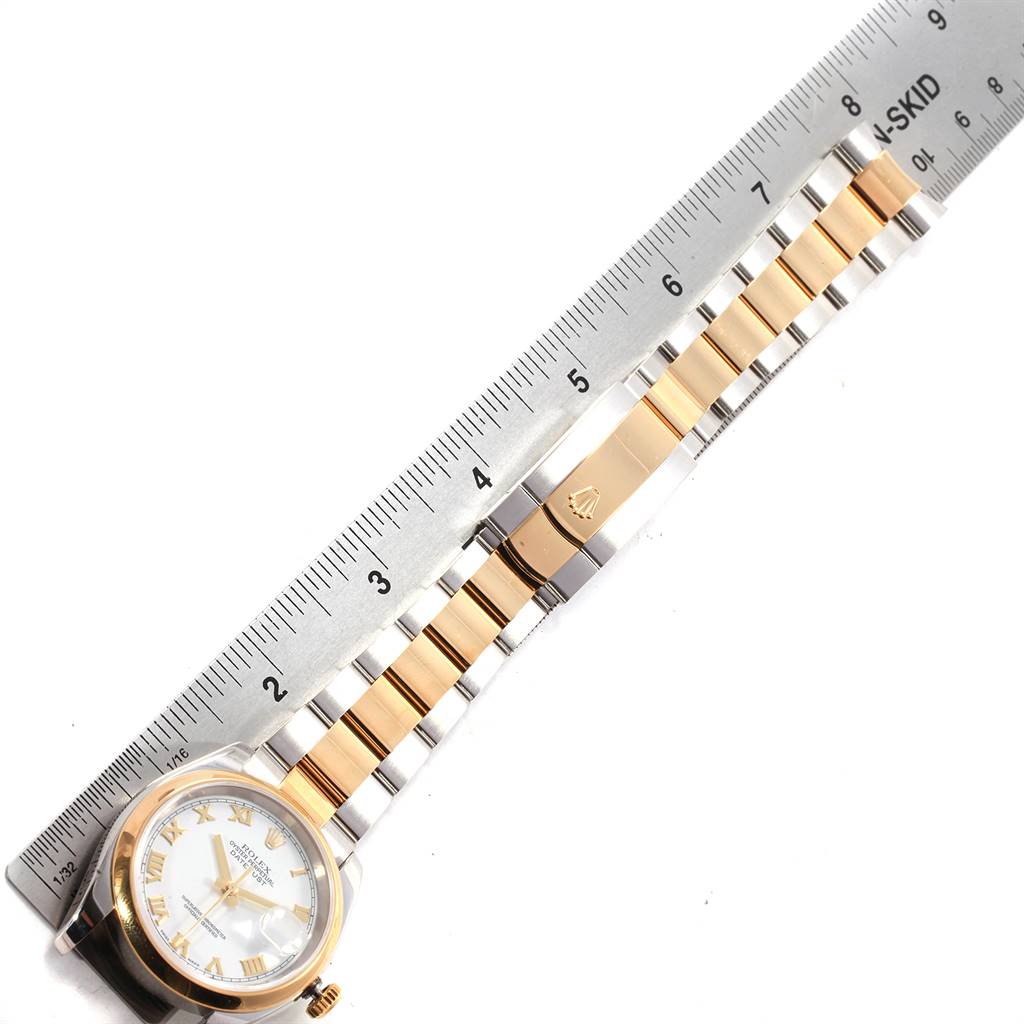 This image shows a top-down view of a Rolex Datejust 116203 Men's Stainless Steel White Dial 116203 Men's Stainless Steel White Dial watch with a ruler indicating the length of its two-tone bracelet.