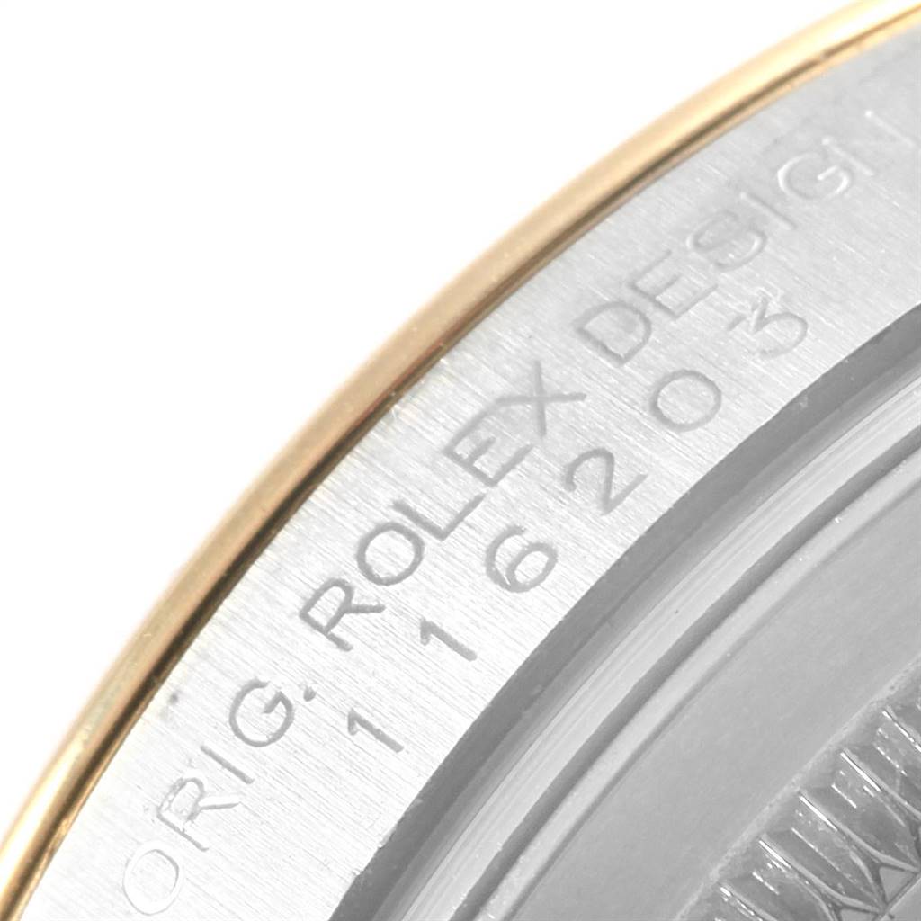 Close-up of the Rolex Datejust 116203 Men's Stainless Steel White Dial 116203 Men's Stainless Steel White Dial model showing the engraved brand name and serial number on the case edge.