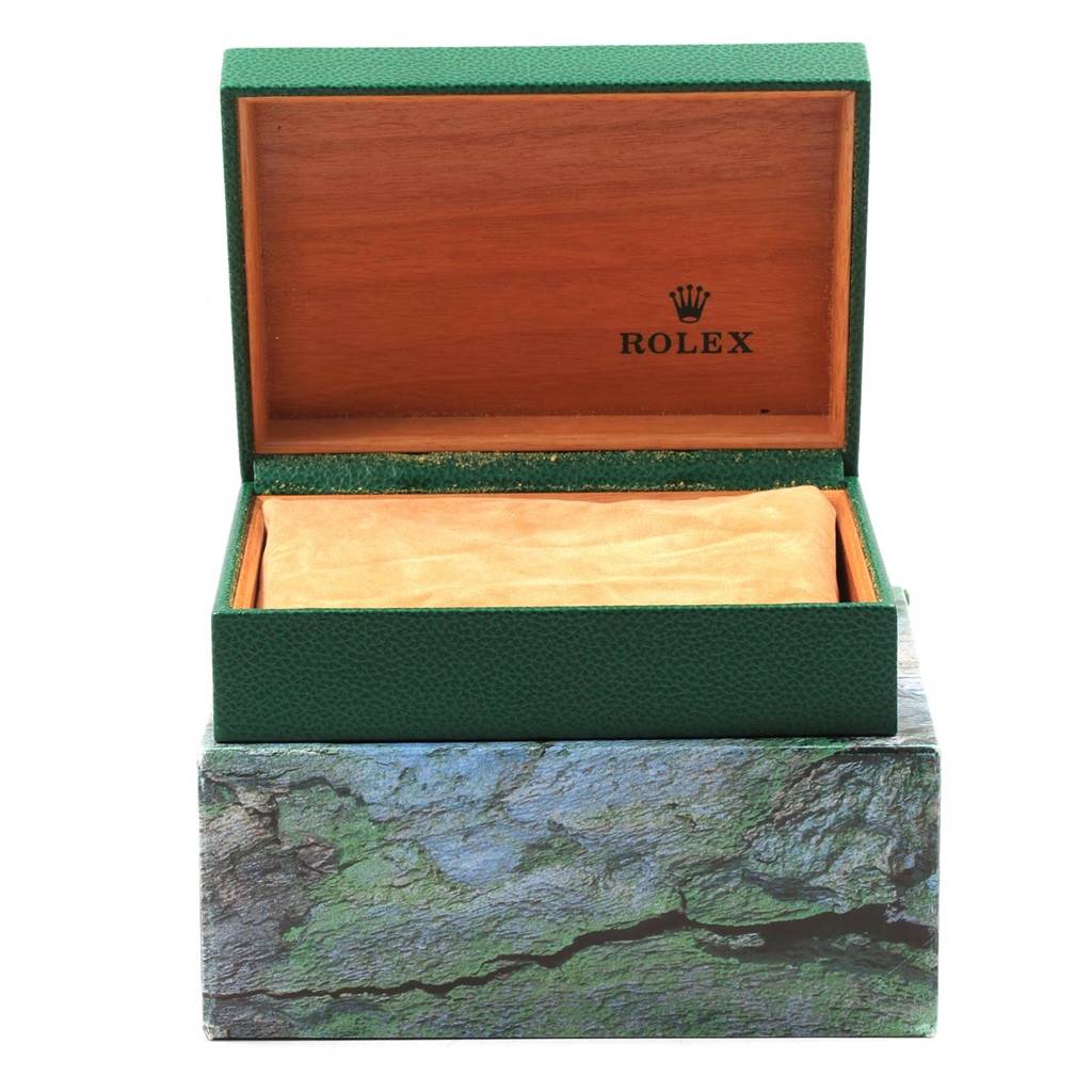 The image shows an open Rolex Datejust 16233 Men's Steel and Gold (two tone) Champagne Dial 16233 Men's Steel and Gold (two tone) Champagne Dial watch box with the brand's logo inside and the cushion for the watch.