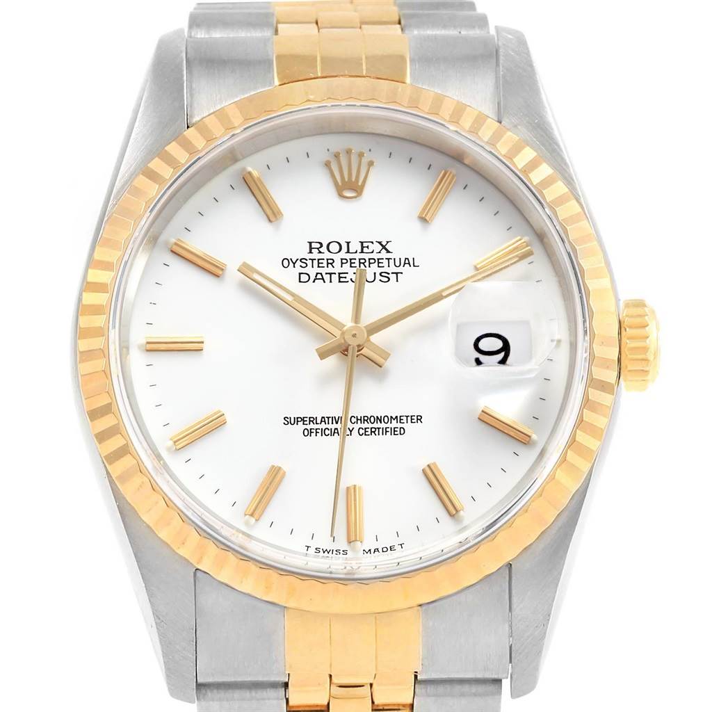 This Rolex Datejust 16233 Men's Steel and Gold (two tone) White Dial 16233 Men's Steel and Gold (two tone) White Dial watch is shown from a front angle, highlighting its dial, hands, fluted bezel, and two-tone bracelet.