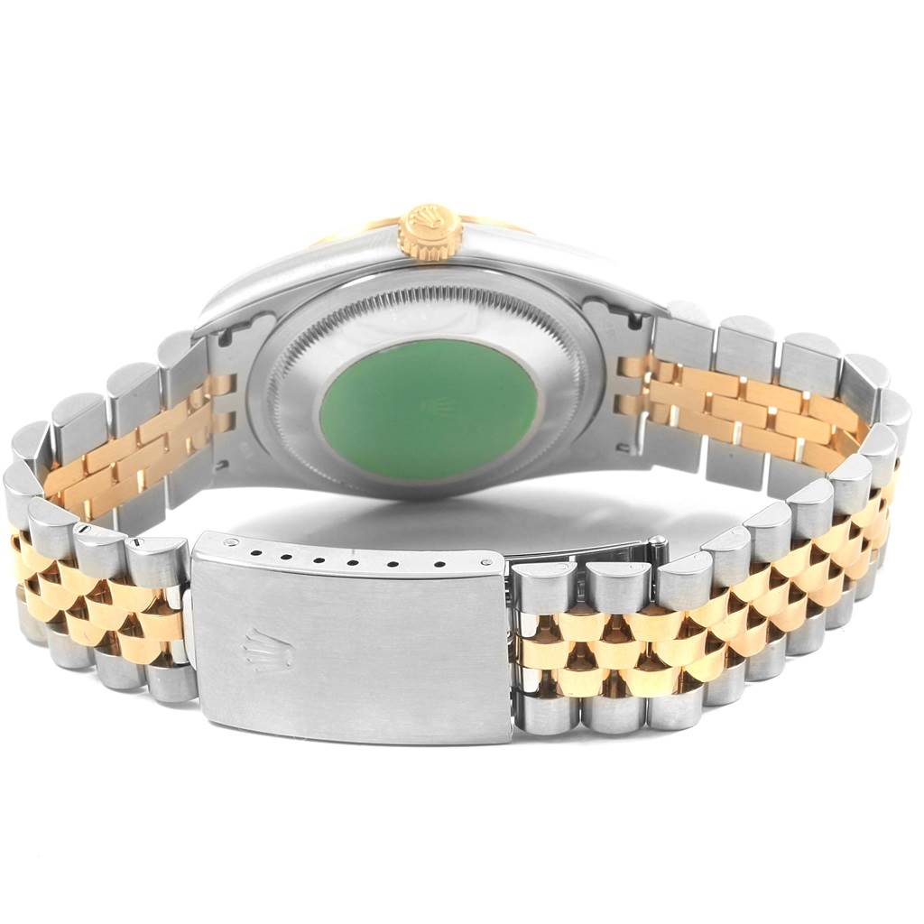 This image shows the back case and Jubilee bracelet of a Rolex Datejust 16233 Men's Steel and Gold (two tone) Silver Dial 16233 Men's Steel and Gold (two tone) Silver Dial watch, highlighting its two-tone metal links and clasp.