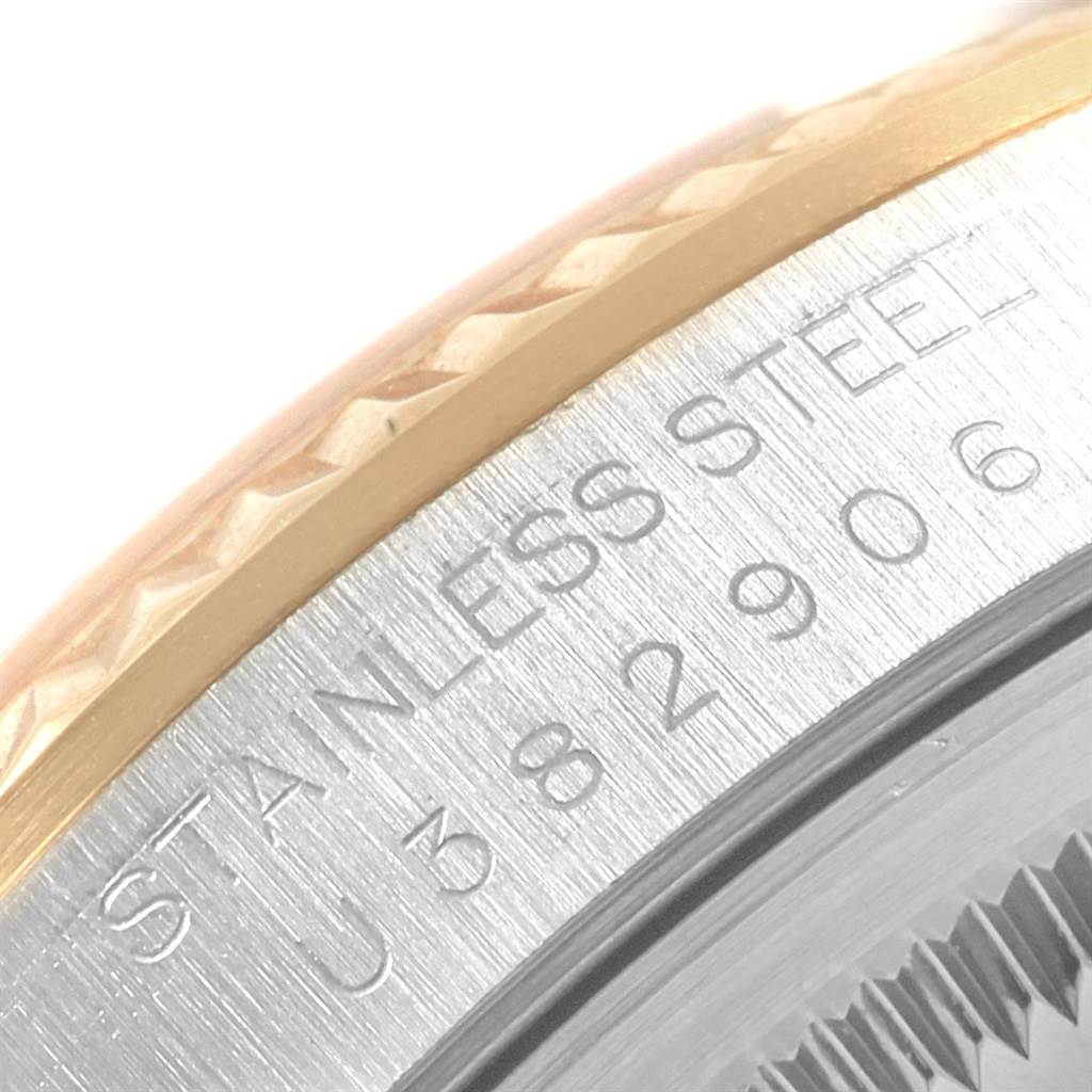 This is a close-up shot of the side of a Rolex Datejust 16233 Men's Steel and Gold (two tone) Silver Dial 16233 Men's Steel and Gold (two tone) Silver Dial watch, showing the stainless steel and part of the bezel.