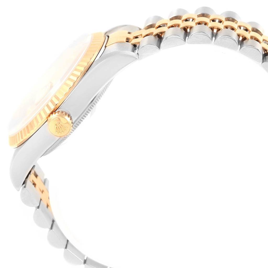 This image shows a side view of the Rolex Datejust 16233 Men's Steel and Gold (two tone) Silver Dial 16233 Men's Steel and Gold (two tone) Silver Dial watch, highlighting its crown, bezel, and two-tone bracelet.