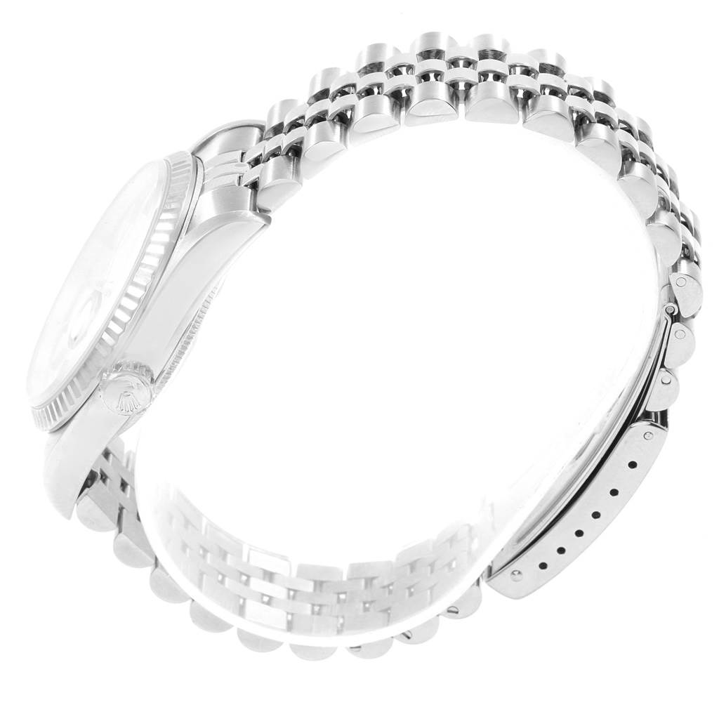 This image shows a side view of a Rolex Datejust 16234 Men's Stainless Steel Silver Dial 16234 Men's Stainless Steel Silver Dial watch, highlighting the case, crown, bezel, and bracelet.