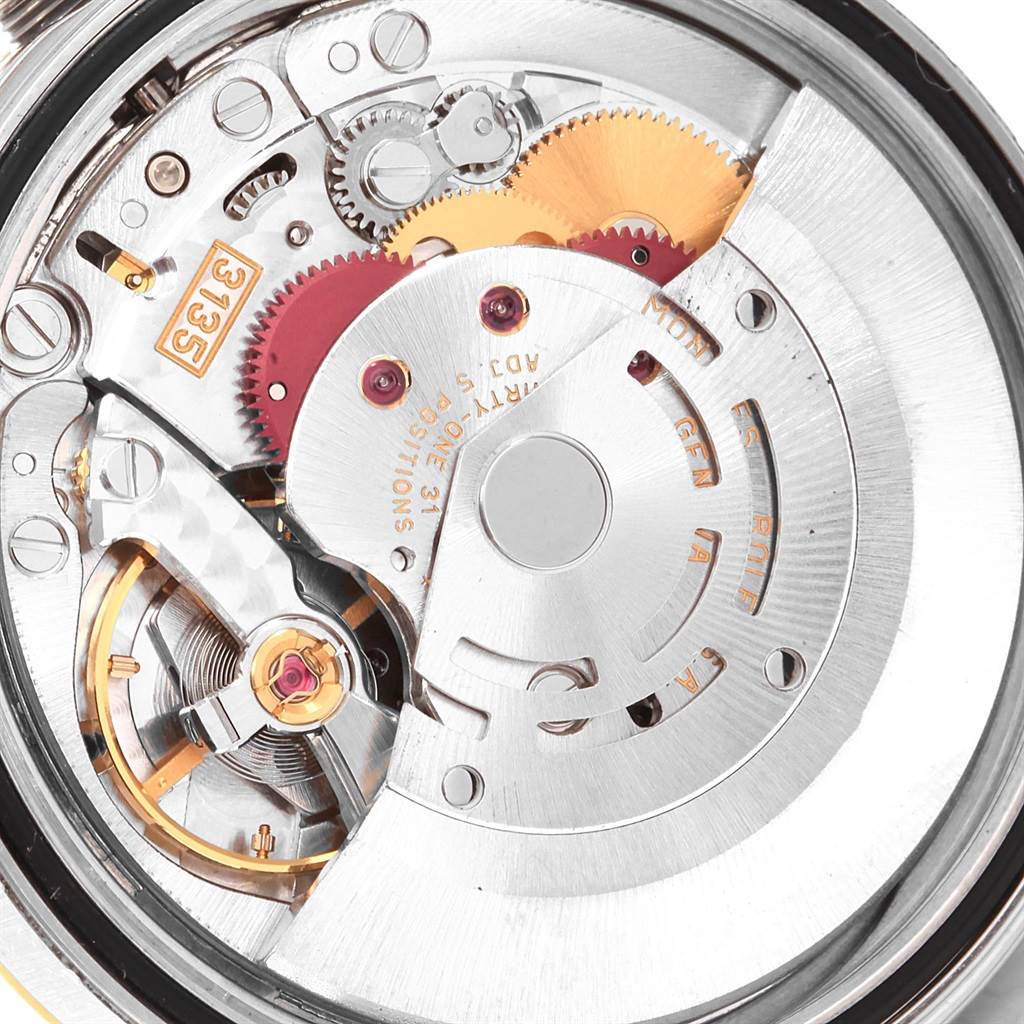 The image shows the intricate inner workings and movement parts of a Rolex Datejust 16233 Men's Steel and Gold (two tone) White Dial 16233 Men's Steel and Gold (two tone) White Dial watch, viewed from the back.