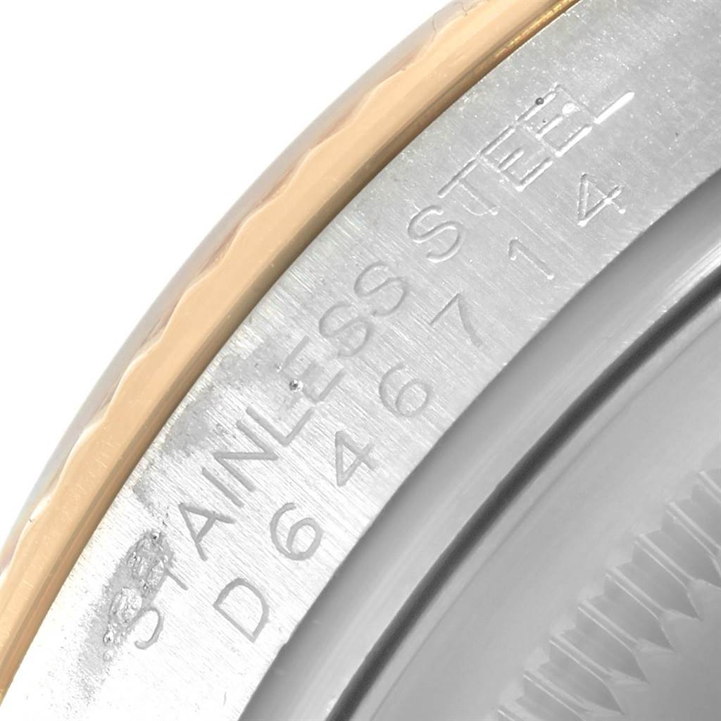 This close-up image shows the bezel and outer casing of a Rolex Datejust 116233 Men
s Stainless Steel Blue Dial 116233 Men
s Stainless Steel Blue Dial watch, highlighting the stainless steel engraving.