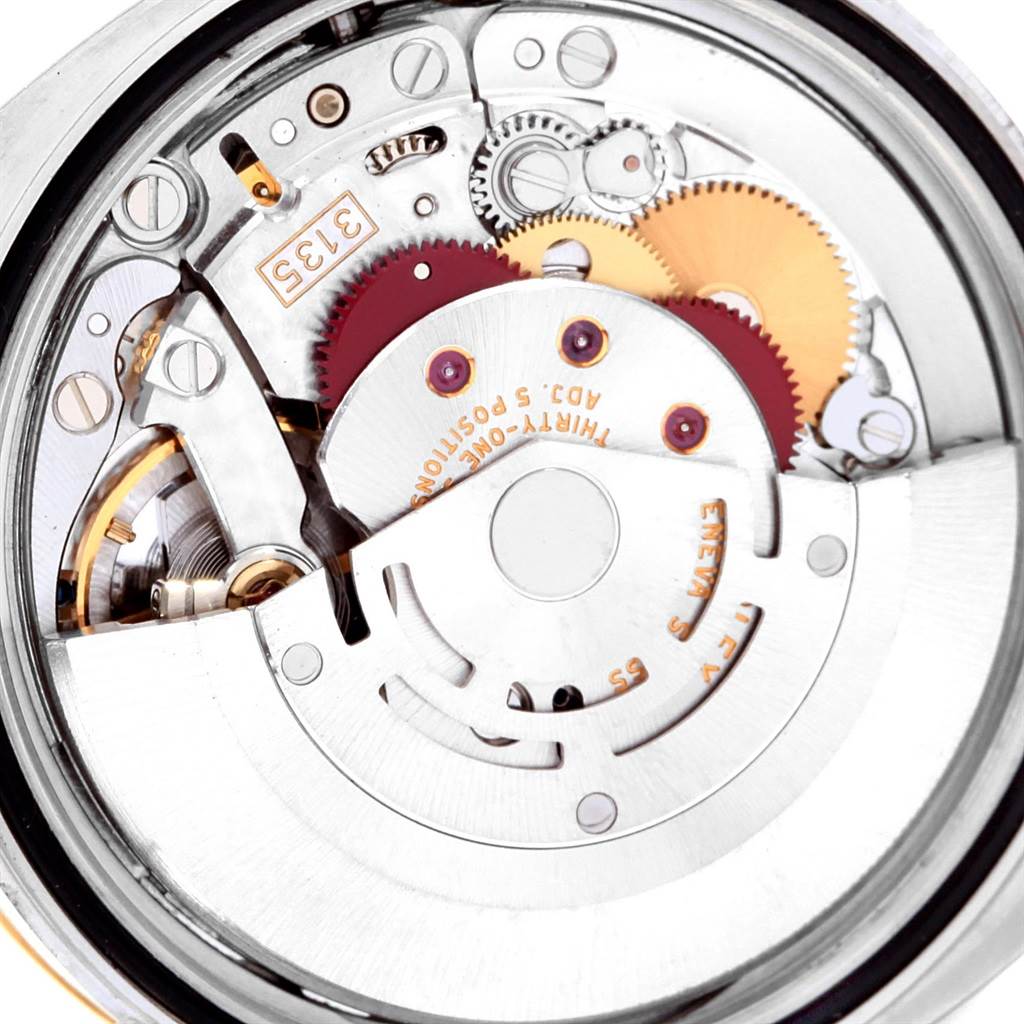 The image shows the inner mechanical movement of a Rolex Datejust 116233 Men
s Stainless Steel Blue Dial 116233 Men
s Stainless Steel Blue Dial watch, viewed from the back.