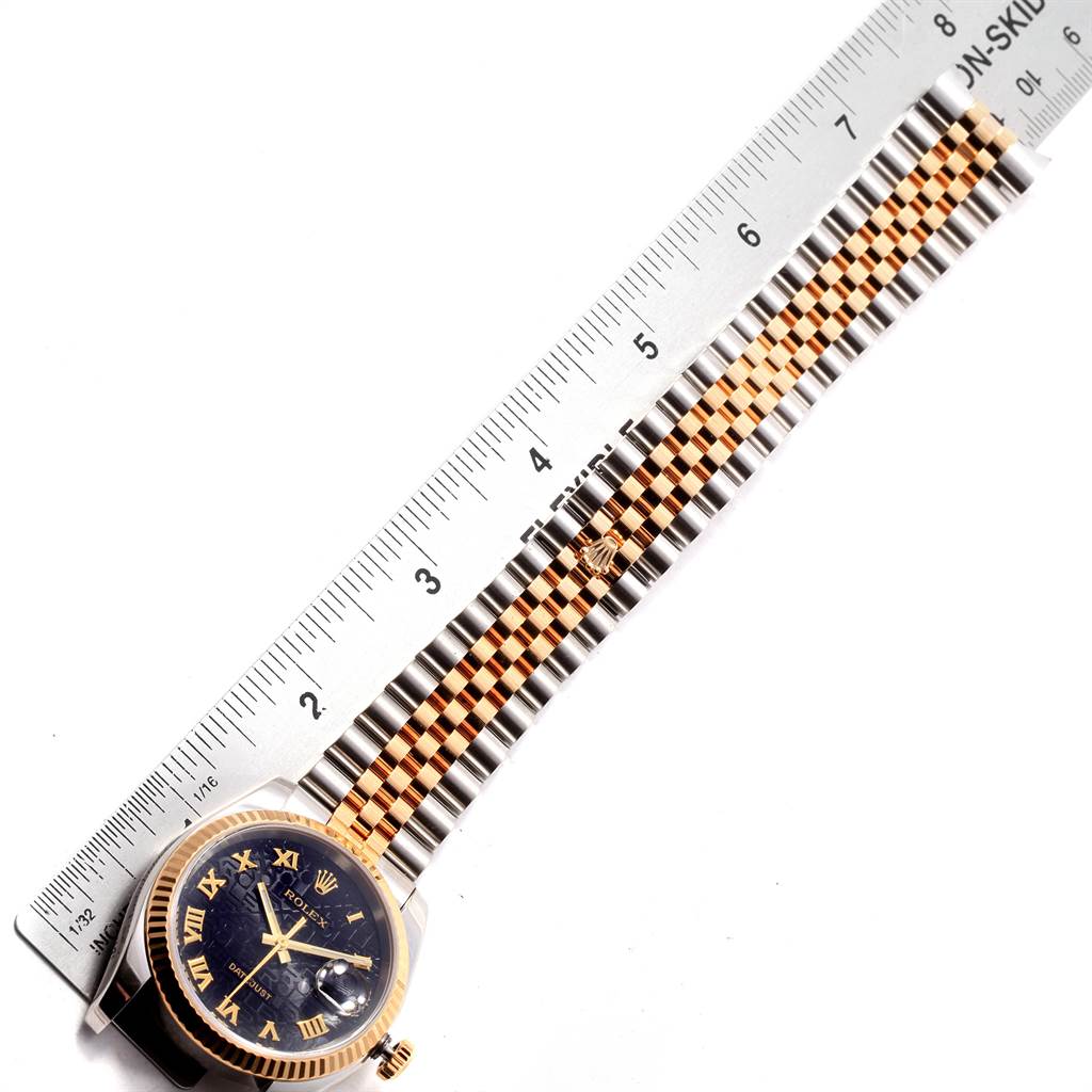 The image shows a Rolex Datejust 116233 Men's Stainless Steel Black Dial 116233 Men's Stainless Steel Black Dial watch laid flat with a blue dial and gold accents, alongside a ruler for measurement.