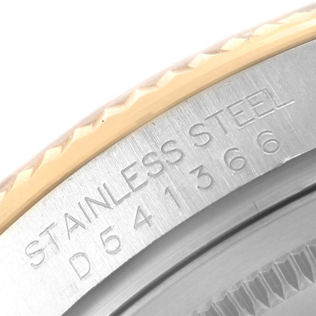 The image shows a detailed close-up of the case back engraving on a Rolex Datejust 116233 Men's Stainless Steel Black Dial 116233 Men's Stainless Steel Black Dial model watch.