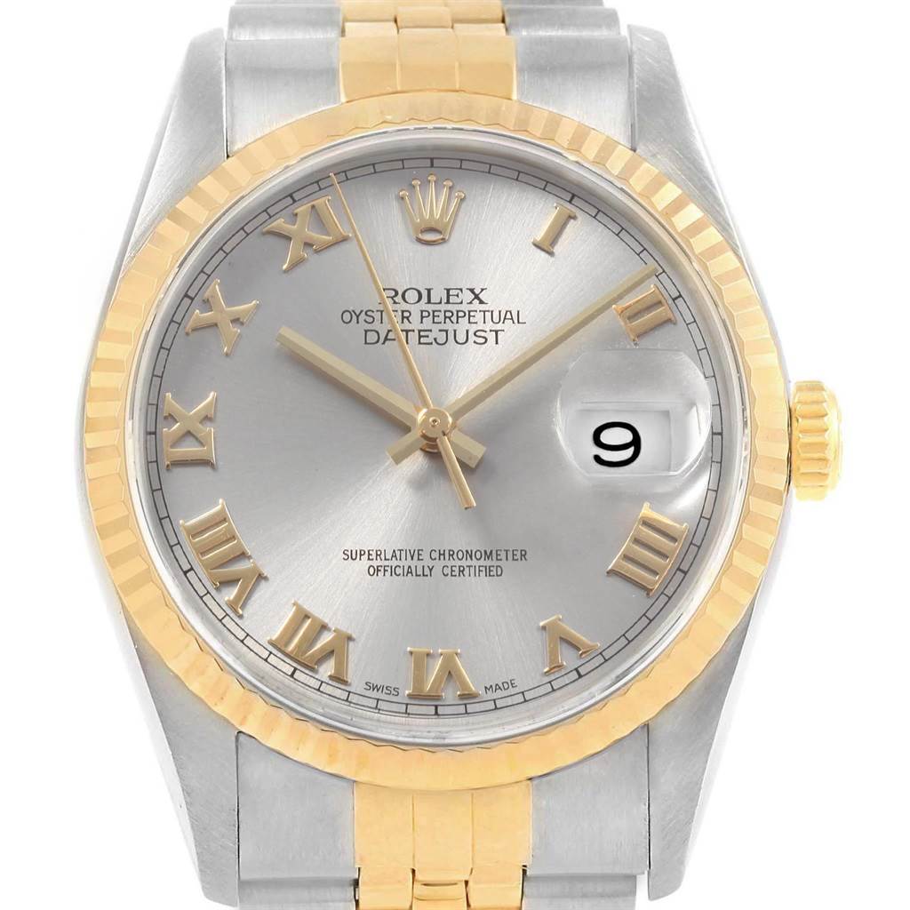 The image shows a front view of a Rolex Datejust 16233 Men's Steel and Gold (two tone) Grey Dial 16233 Men's Steel and Gold (two tone) Grey Dial watch, highlighting its Roman numeral dial, gold bezel, and silver and gold bracelet.