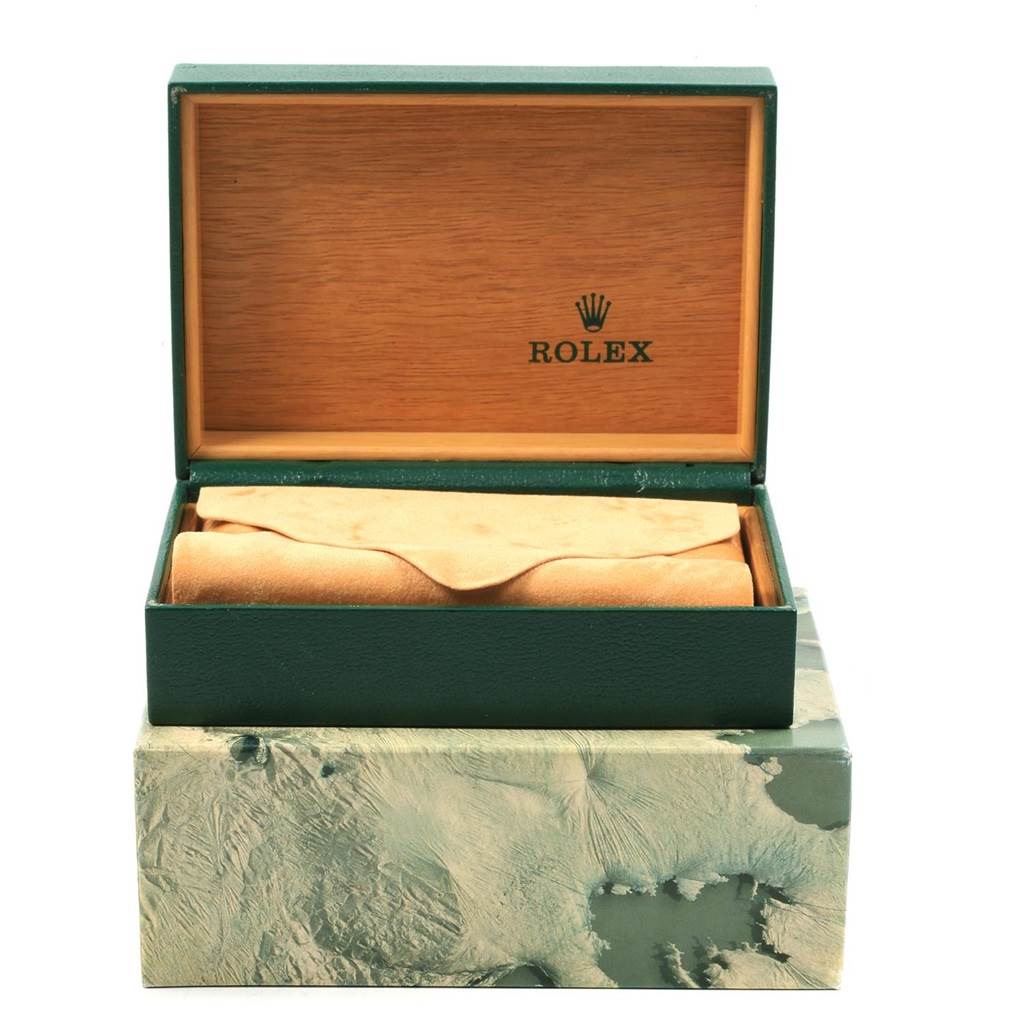 This image shows the open box and pouch for a Rolex Datejust 16233 Men's Steel and Gold (two tone) Champagne Dial 16233 Men's Steel and Gold (two tone) Champagne Dial watch, revealing its packaging.