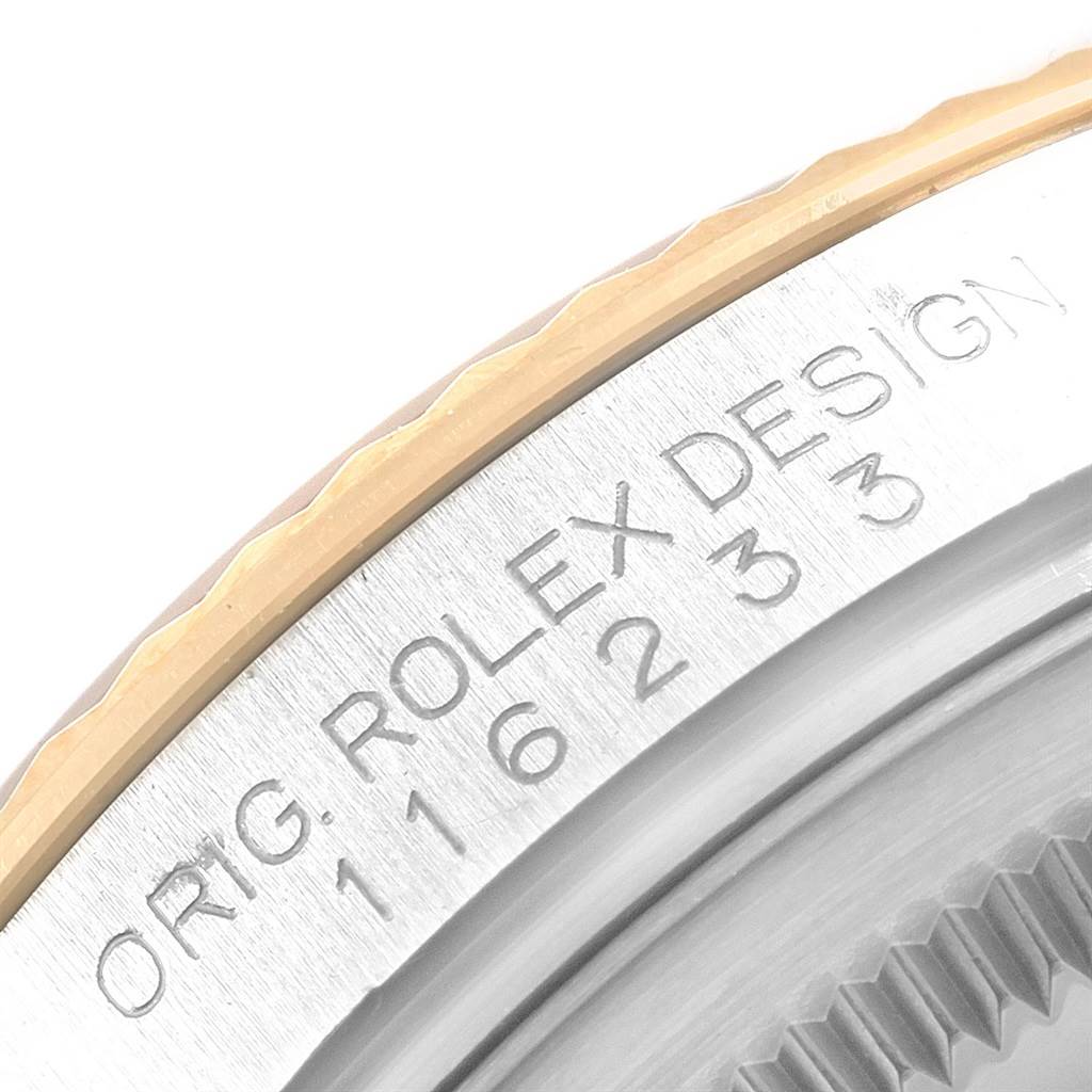 This image shows a close-up of the bezel and rehaut of a Rolex Datejust 116233 Men's Stainless Steel Silver Dial 116233 Men's Stainless Steel Silver Dial model, displaying the engraved text.