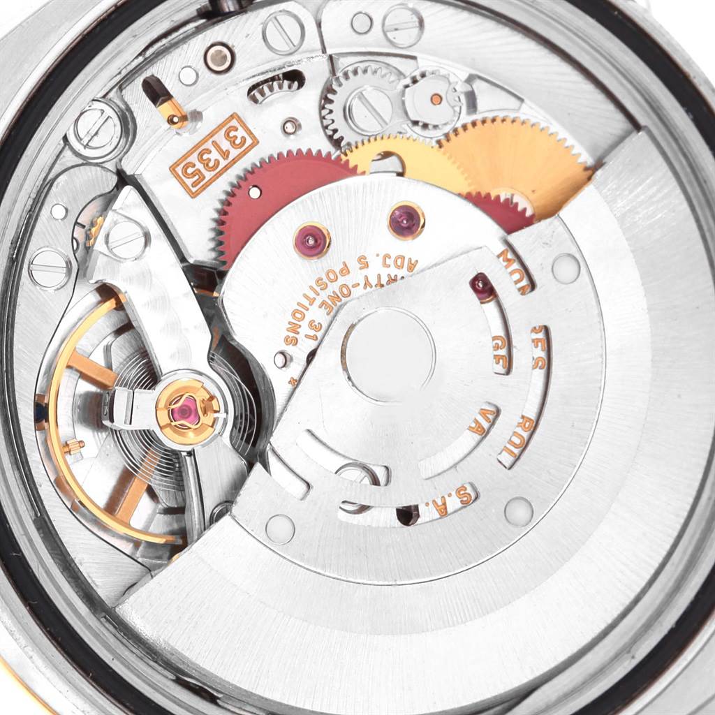 This image shows the internal mechanism of a Rolex Datejust 116203 Men's Stainless Steel Champagne Dial 116203 Men's Stainless Steel Champagne Dial watch, highlighting components like gears and the rotor.