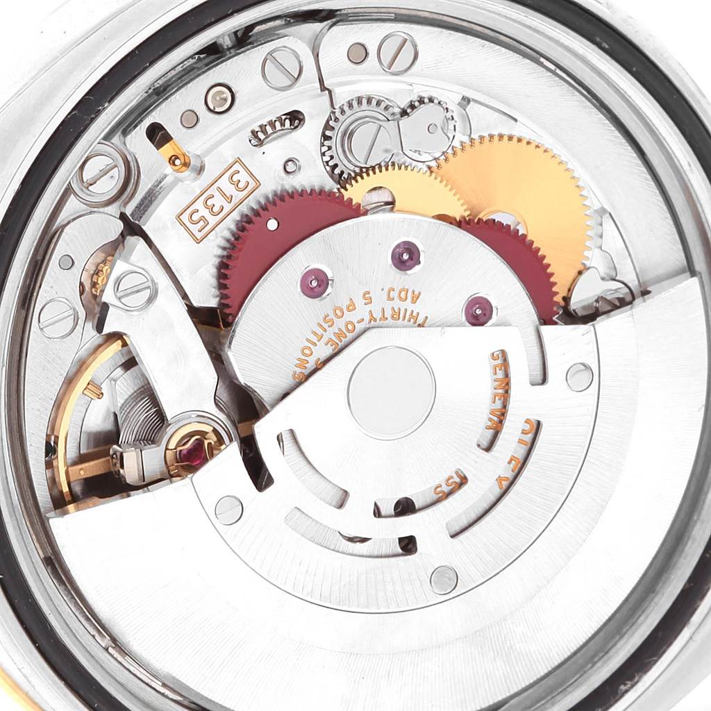 This image shows the intricate inner mechanical movement of the Rolex Datejust 116243 Men
s Stainless Steel Brown Dial 116243 Men
s Stainless Steel Brown Dial watch, highlighting gears and components.