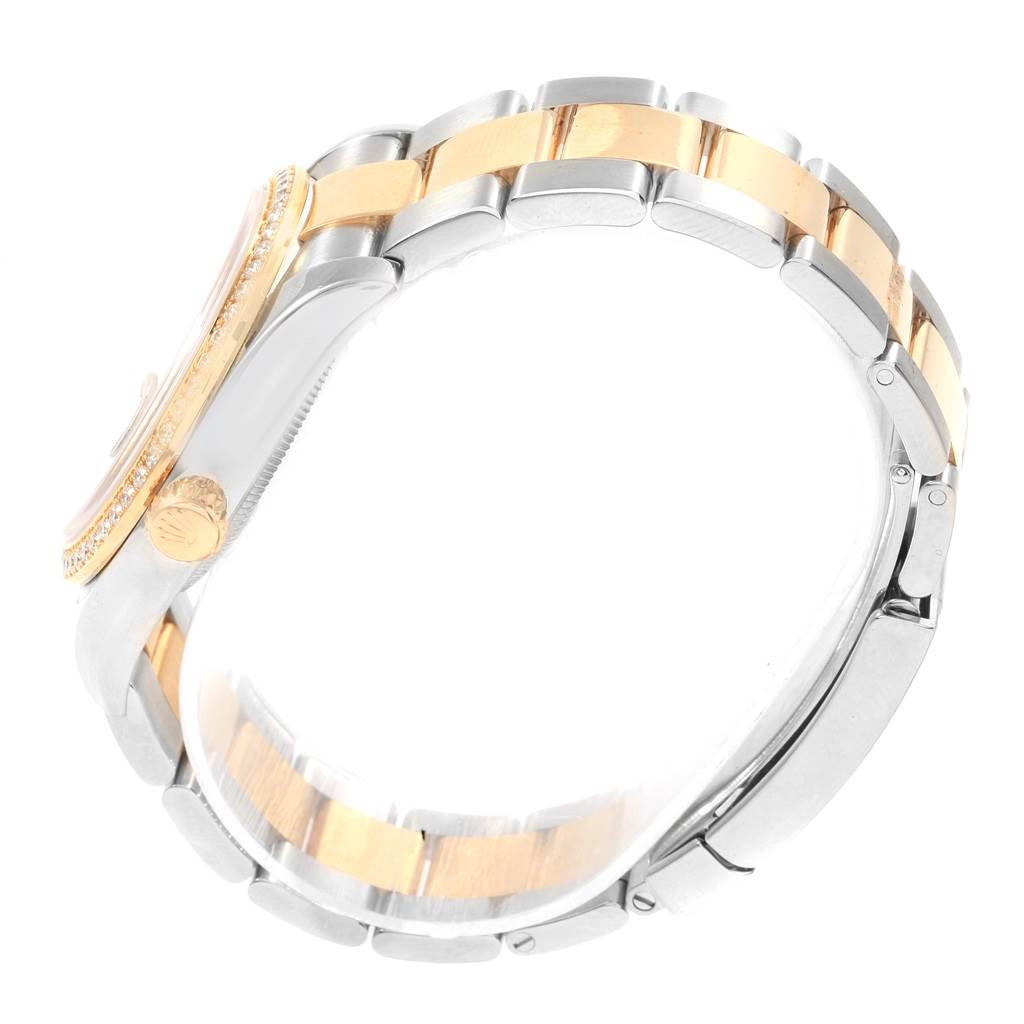 The image shows a side view of a Rolex Datejust 116243 Men
s Stainless Steel Brown Dial 116243 Men
s Stainless Steel Brown Dial watch, focusing on the case, crown, and two-tone bracelet.