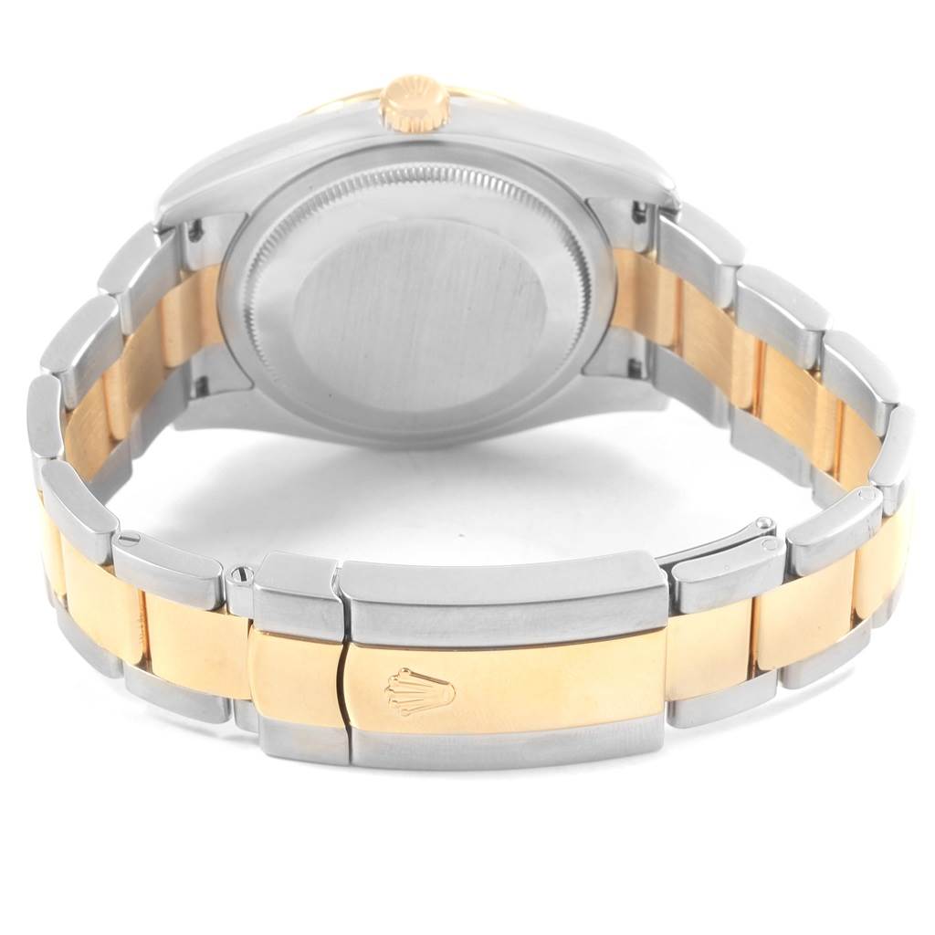 This image shows the back view of a Rolex Datejust 116243 Men
s Stainless Steel Brown Dial 116243 Men
s Stainless Steel Brown Dial watch, highlighting its case back, crown, and two-tone bracelet clasp.