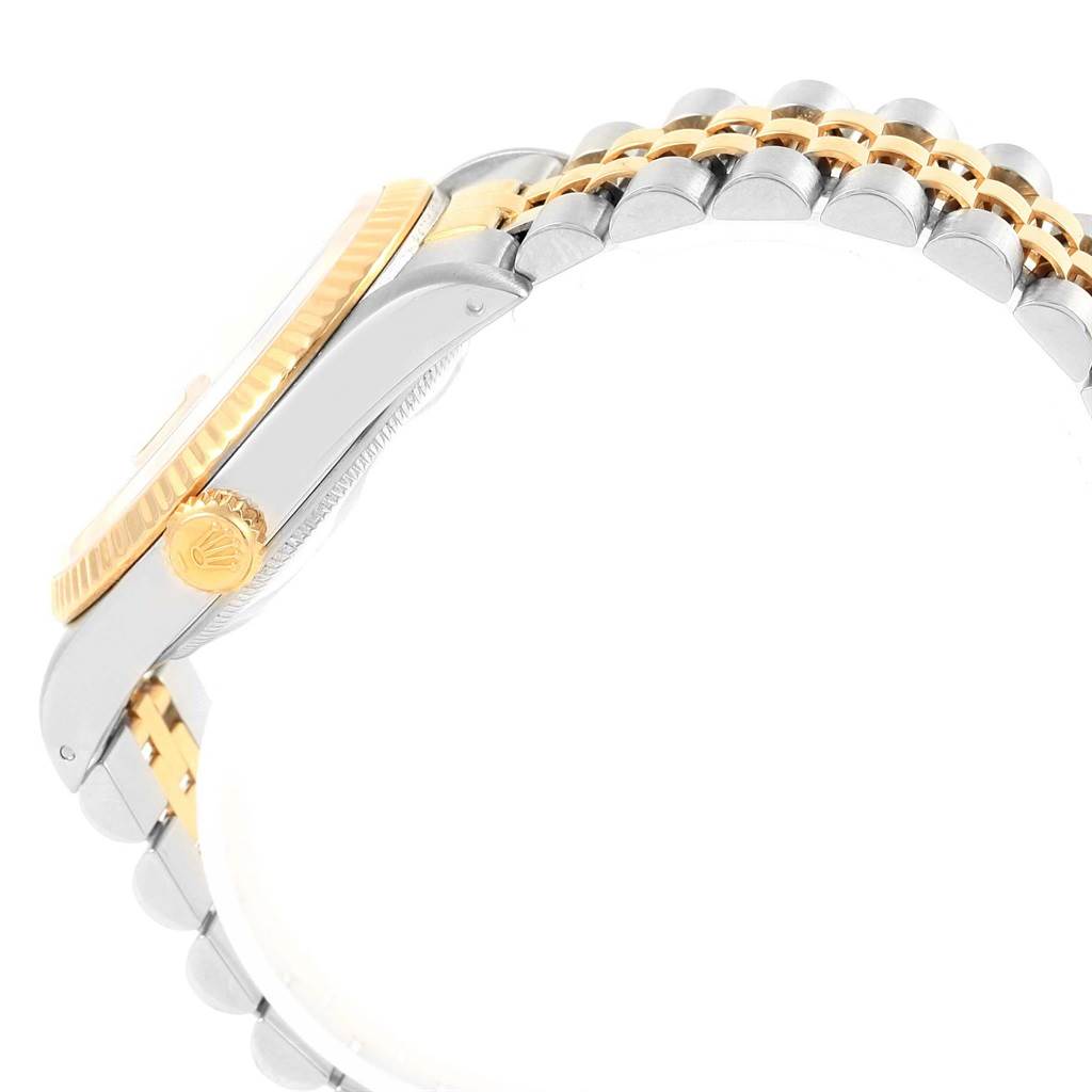 This image shows the side view of a Rolex Datejust 16233 Men's Steel and Gold (two tone) Champagne Dial 16233 Men's Steel and Gold (two tone) Champagne Dial watch, highlighting its bezel, crown, and bracelet.