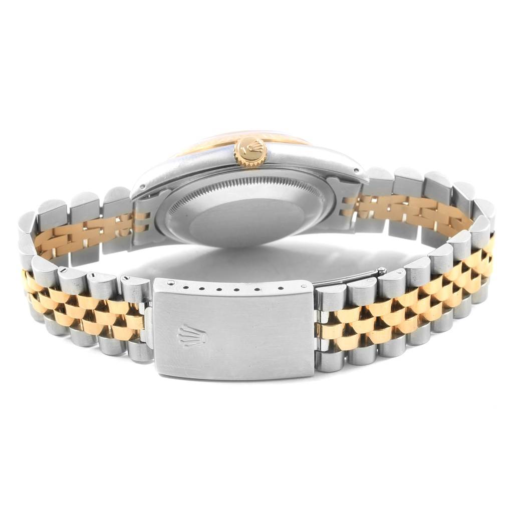 This image shows the back case, crown, and bracelet of a Rolex Datejust 16233 Men's Steel and Gold (two tone) Champagne Dial 16233 Men's Steel and Gold (two tone) Champagne Dial watch.