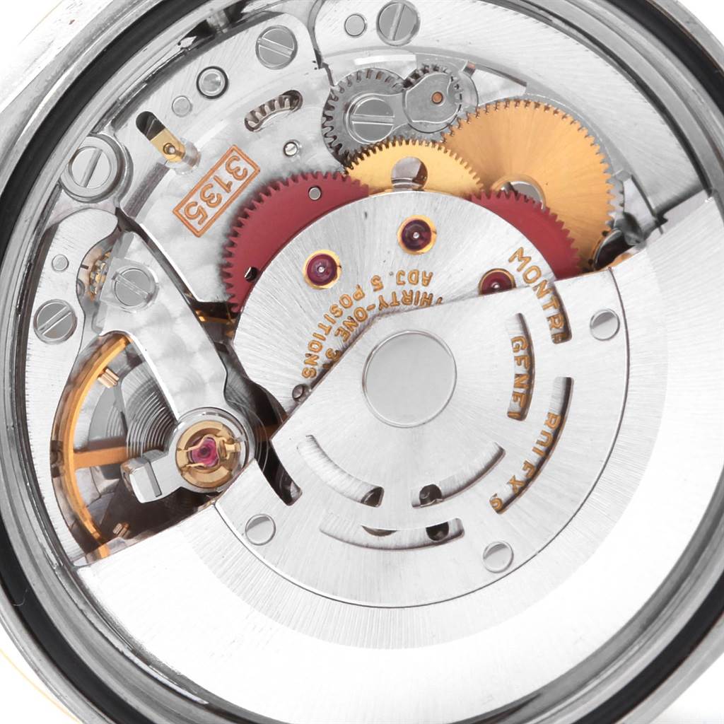 The image shows a close-up of the movement mechanism inside a Datejust model by Rolex.