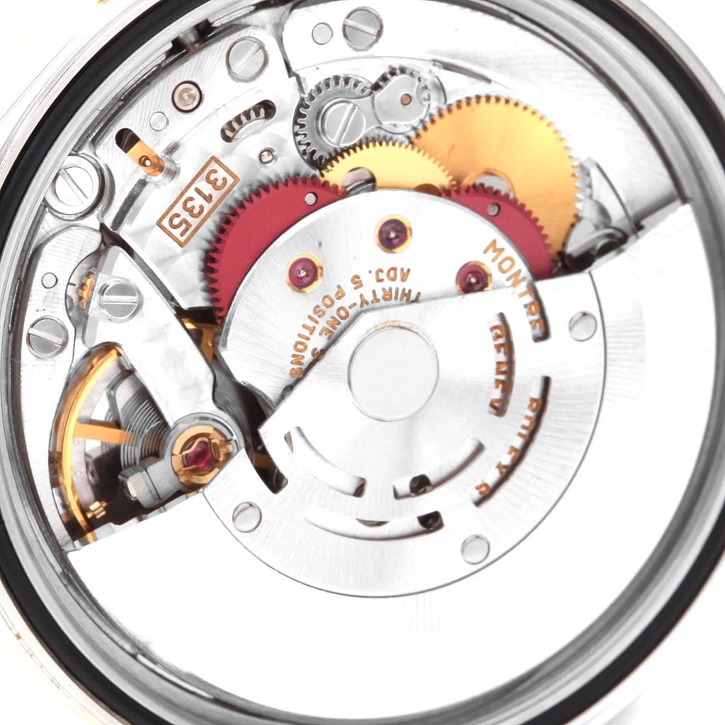 This image shows the intricate internal mechanism of the Rolex Datejust 16233 Men's Steel and Gold (two tone) Champagne Dial 16233 Men's Steel and Gold (two tone) Champagne Dial watch, highlighting the gears and cogs.