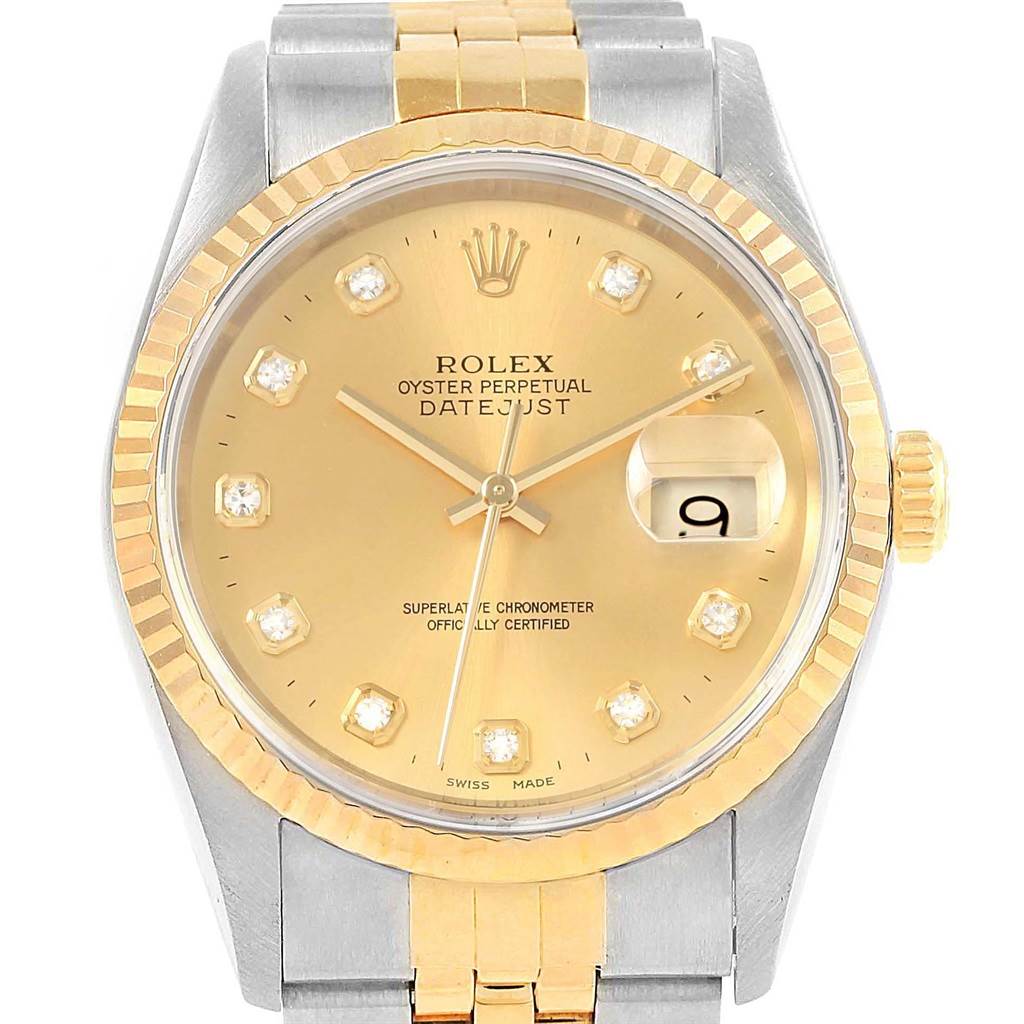 This is a front view of a Rolex Datejust 16233 Men's Steel and Gold (two tone) Champagne Dial 16233 Men's Steel and Gold (two tone) Champagne Dial watch, showcasing the dial, hour markers, crown, and part of the bracelet.