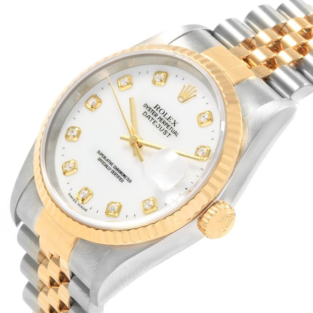 This image shows a Rolex Datejust 16233 Men's Steel and Gold (two tone) White Dial 16233 Men's Steel and Gold (two tone) White Dial watch at an oblique angle, highlighting its dial, case, bezel, crown, and part of the bracelet.