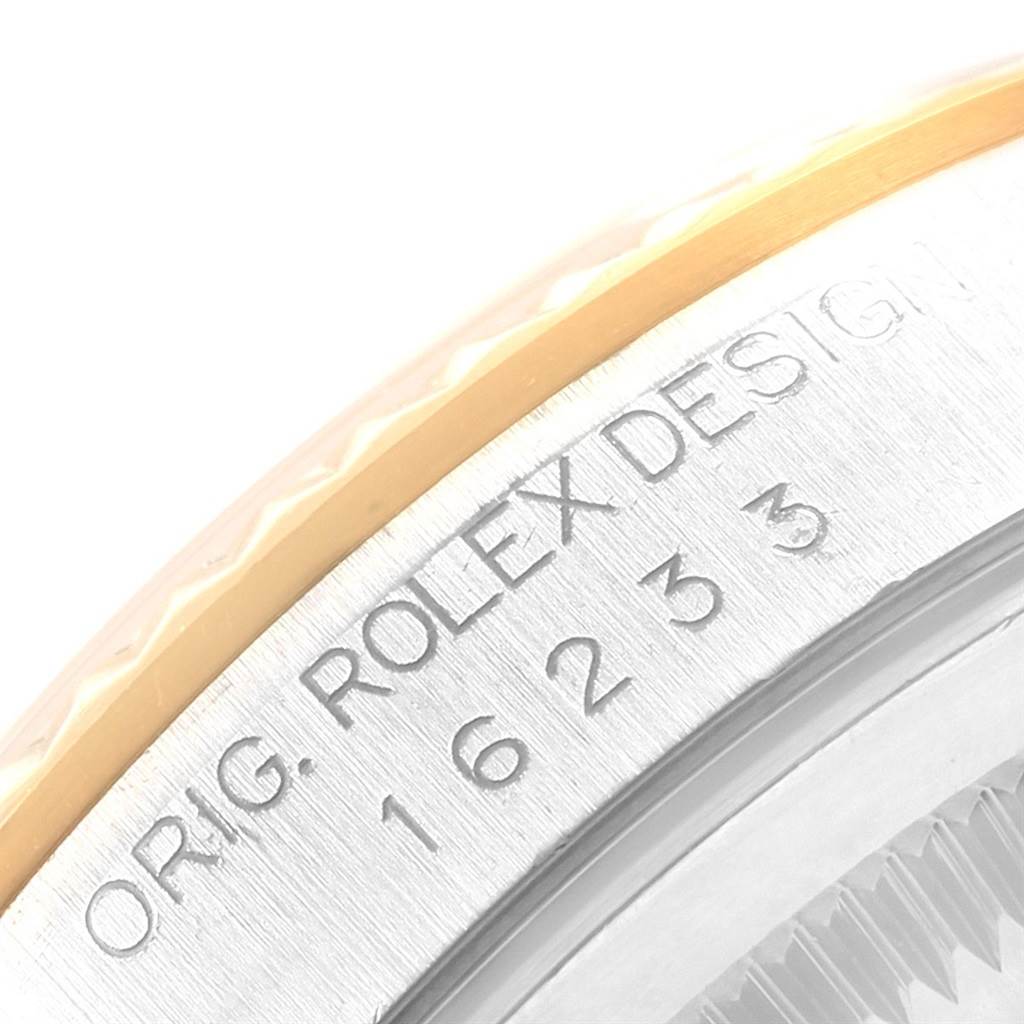 The image displays a close-up of the bezel and engraved model number of a Rolex Datejust 16233 Men's Steel and Gold (two tone) White Dial 16233 Men's Steel and Gold (two tone) White Dial watch.