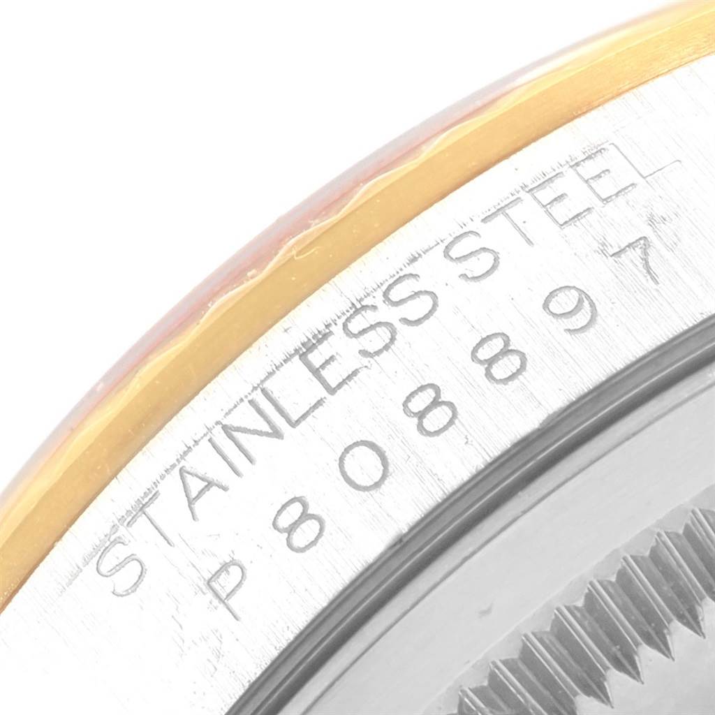 The image shows a close-up of the bezel and case-back engraving on a Rolex Datejust 16233 Men's Steel and Gold (two tone) White Dial 16233 Men's Steel and Gold (two tone) White Dial watch.