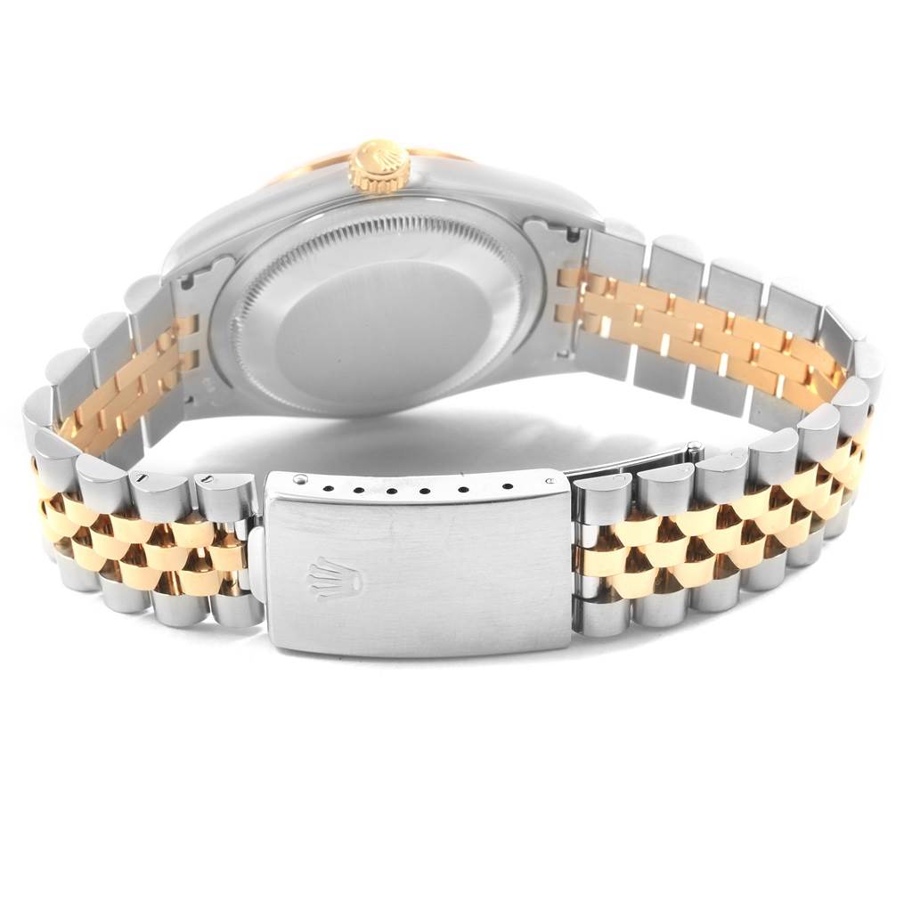 The image shows the back view of a Rolex Datejust 16233 Men's Steel and Gold (two tone) White Dial 16233 Men's Steel and Gold (two tone) White Dial watch, highlighting its two-tone bracelet and clasp.