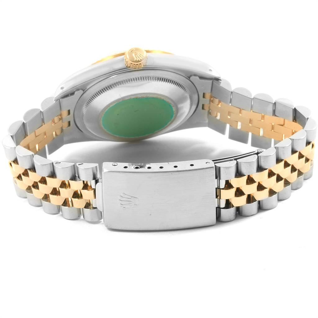 The image shows the back view of a Rolex Datejust 16233 Men's Steel and Gold (two tone) White Dial 16233 Men's Steel and Gold (two tone) White Dial watch, highlighting its caseback, crown, and two-tone bracelet with clasp.