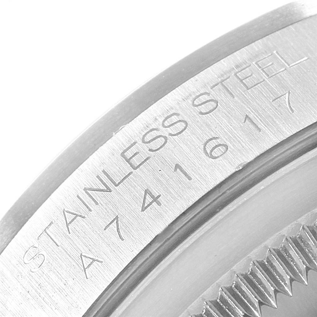 This image shows a close-up of the engraved text on the stainless steel case back of a Rolex Datejust 16200 Men's Stainless Steel Silver Dial 16200 Men's Stainless Steel Silver Dial model.