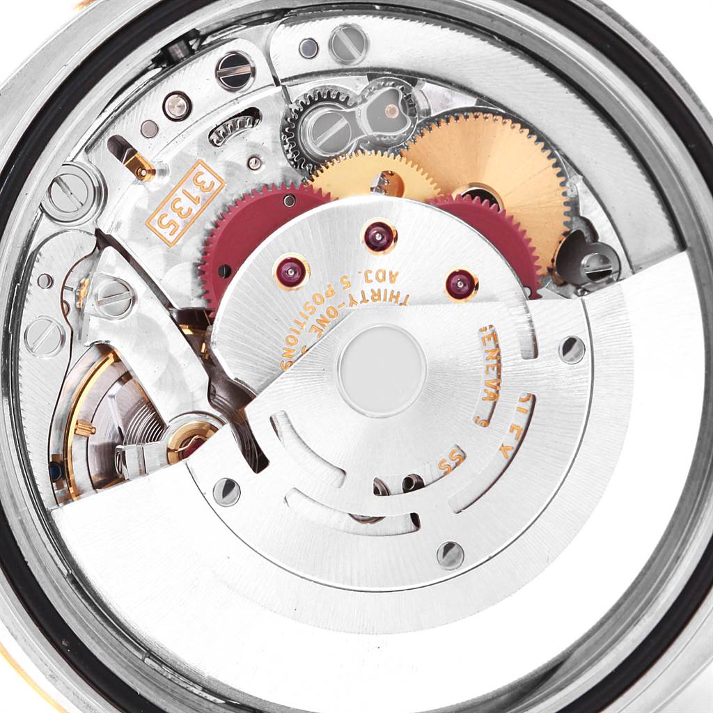 The image shows the intricate internal mechanism of a Rolex Datejust 116233 Men's Stainless Steel White Dial 116233 Men's Stainless Steel White Dial watch, viewed from the back.