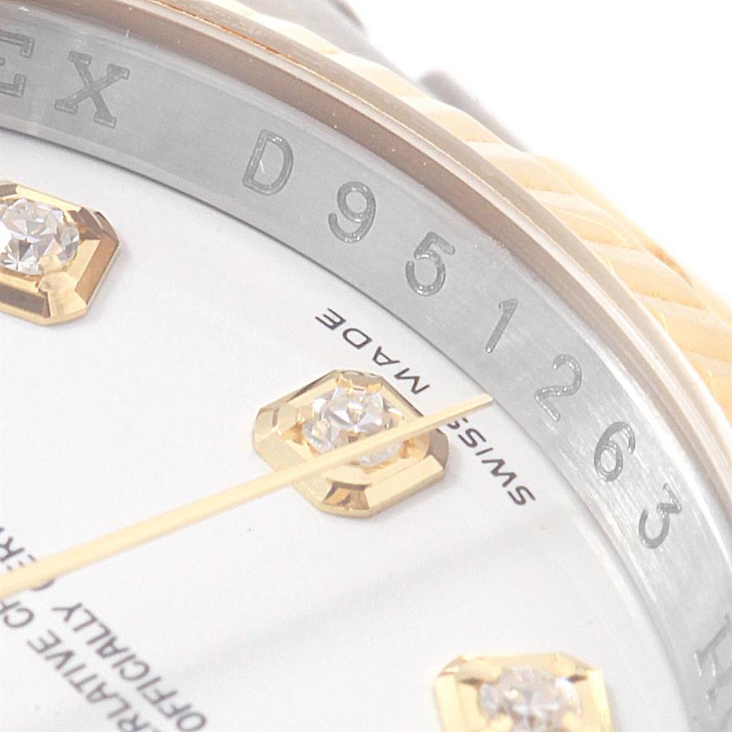 This close-up angle of the Rolex Datejust 116233 Men's Stainless Steel White Dial 116233 Men's Stainless Steel White Dial watch shows part of the dial, bezel, and diamond hour markers.