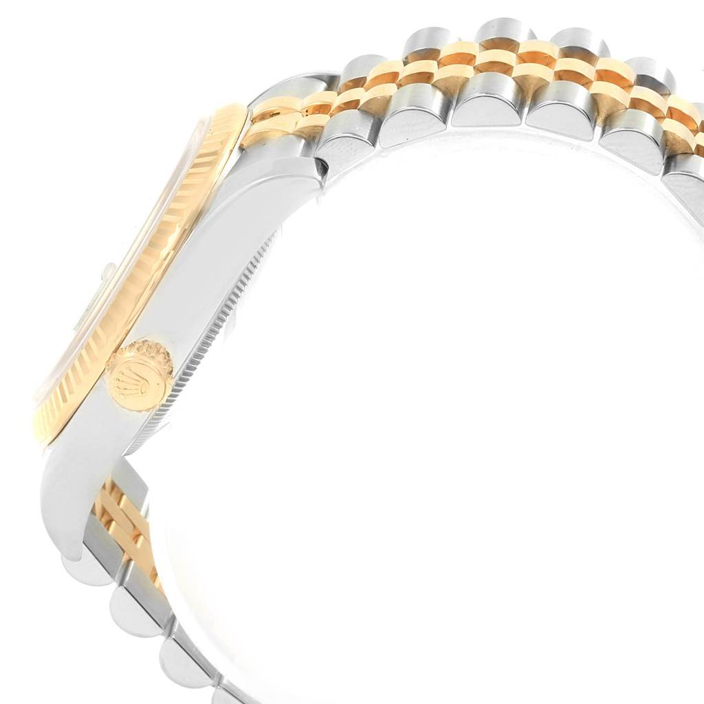 This side view of the Rolex Datejust 116233 Men's Stainless Steel White Dial 116233 Men's Stainless Steel White Dial watch shows the case, crown, and two-tone bracelet.