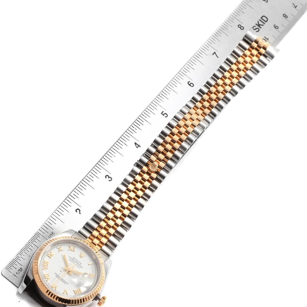 The image shows a Rolex Datejust 116233 Men's Stainless Steel White Dial 116233 Men's Stainless Steel White Dial watch laid flat with the face and full length of the bracelet visible next to a ruler.