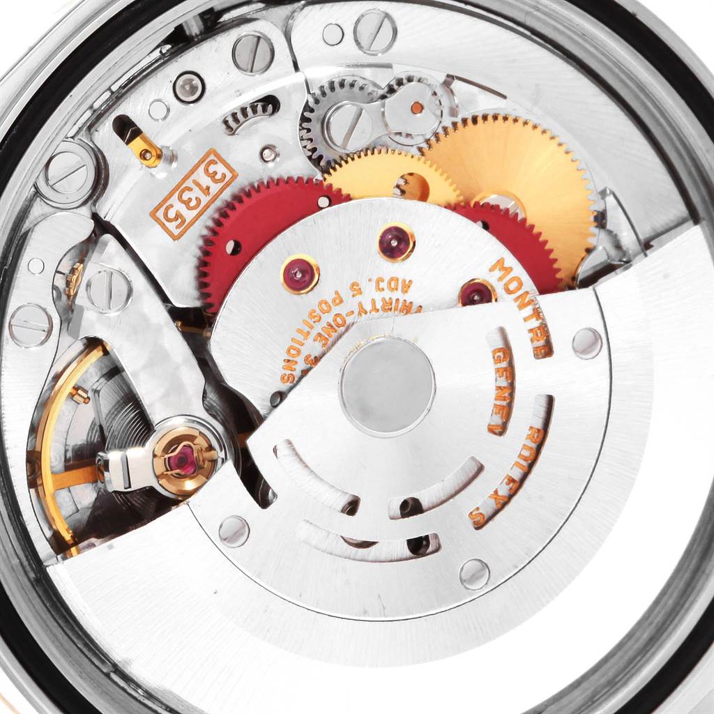 This image shows the inner mechanical movement of a Rolex Datejust 16233 Men's Steel and Gold (two tone) Champagne Dial 16233 Men's Steel and Gold (two tone) Champagne Dial watch, highlighting the gears, rotor, and intricate components.