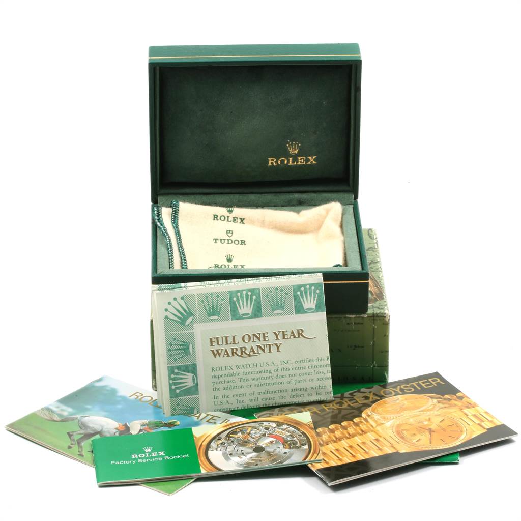 This image shows a Rolex Datejust 16233 Men's Steel and Gold (two tone) Champagne Dial 16233 Men's Steel and Gold (two tone) Champagne Dial watch box, a warranty card, booklets, and a cushion, viewed from a front angle.