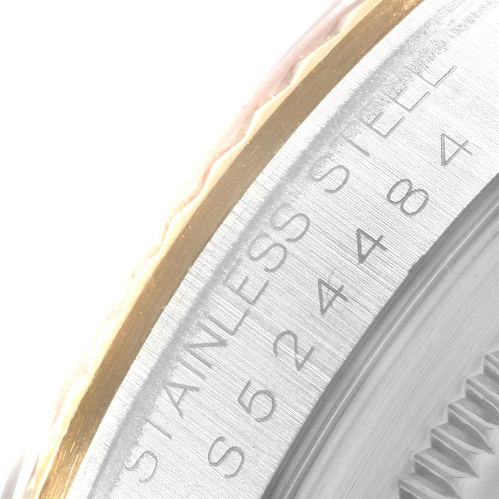 This close-up image shows the side of the bezel and the serial number of the Rolex Datejust 16233 Men's Steel and Gold (two tone) Blue Dial 16233 Men's Steel and Gold (two tone) Blue Dial model watch.