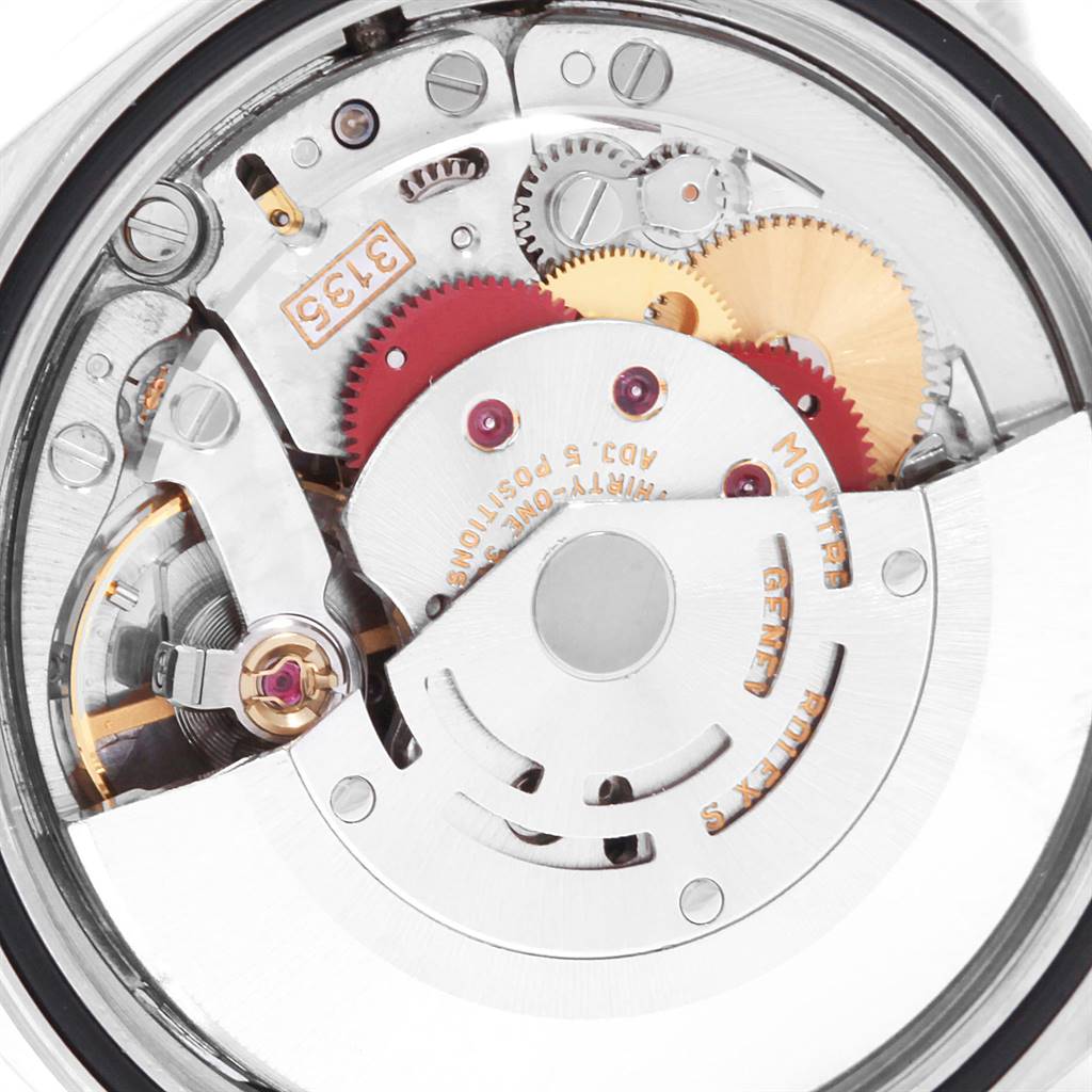 The image shows a close-up of the movement mechanism of a Rolex Datejust 16233 Men's Steel and Gold (two tone) Blue Dial 16233 Men's Steel and Gold (two tone) Blue Dial watch.
