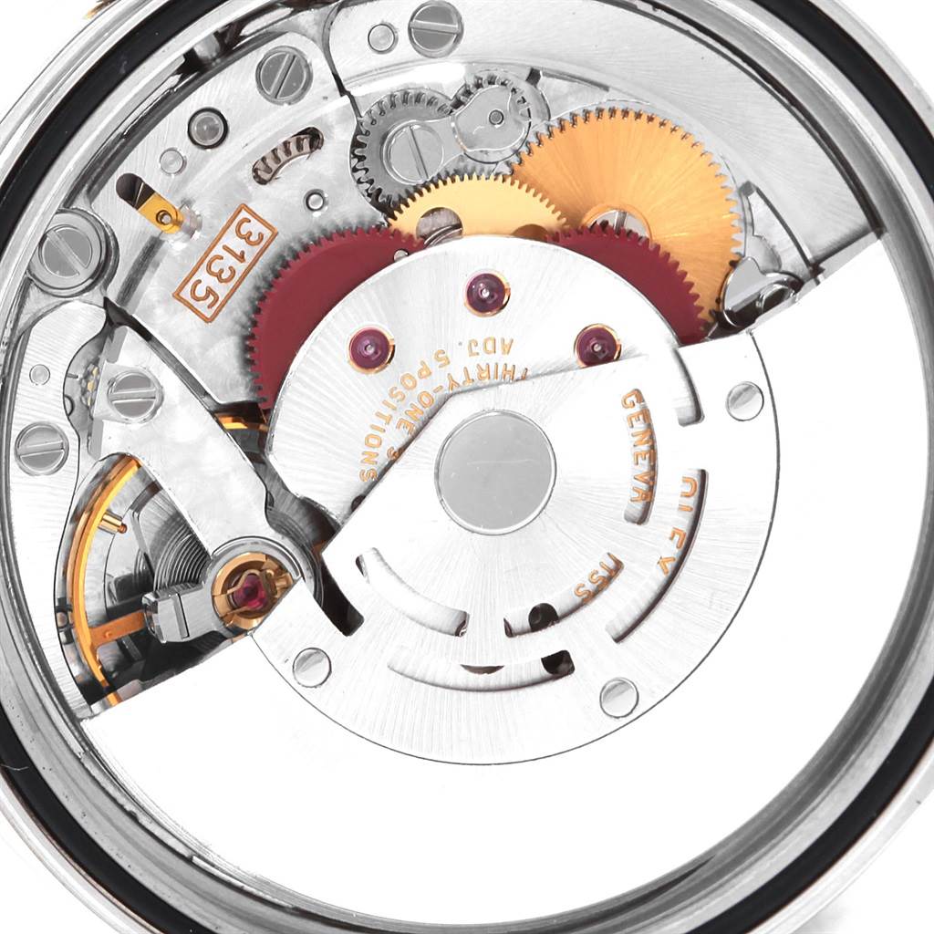 This is a close-up view of the internal movement mechanism of a Rolex Datejust 16233 Men's Steel and Gold (two tone) Champagne Dial 16233 Men's Steel and Gold (two tone) Champagne Dial watch, showing gears and intricate parts.