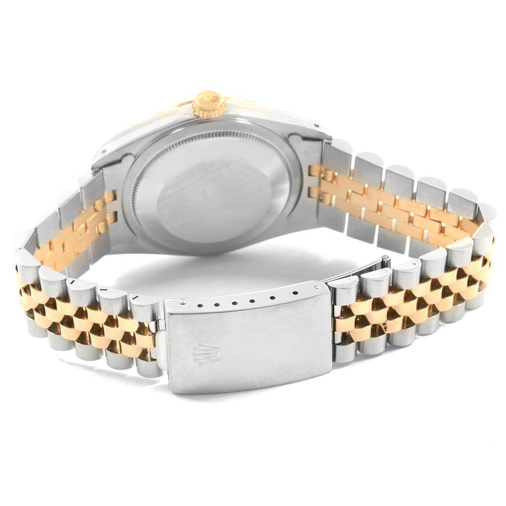 This image of a Rolex Datejust 16233 Men's Steel and Gold (two tone) Champagne Dial 16233 Men's Steel and Gold (two tone) Champagne Dial watch shows the back case and the two-tone bracelet from a rear angle.