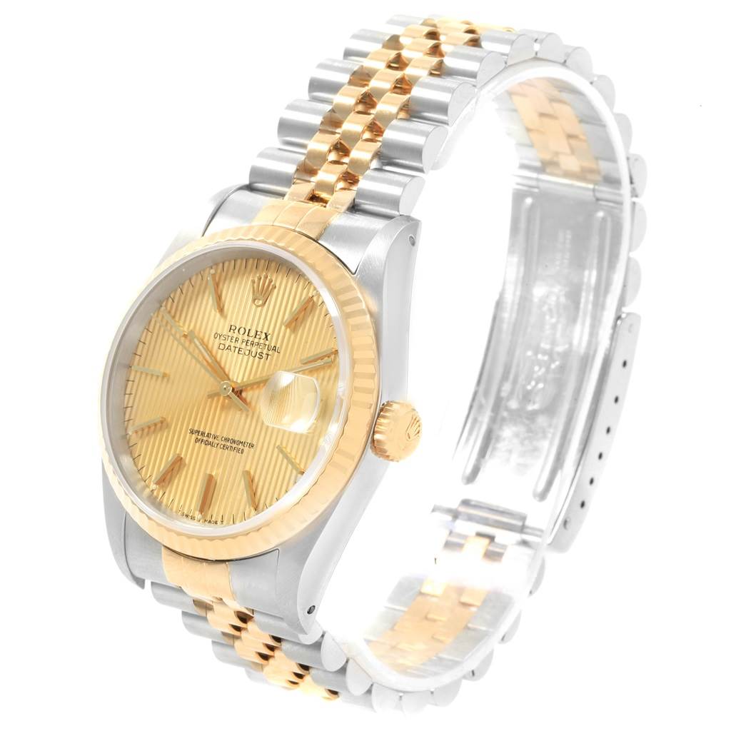 The image shows a Rolex Datejust 16233 Men's Steel and Gold (two tone) Champagne Dial 16233 Men's Steel and Gold (two tone) Champagne Dial watch at a three-quarter angle highlighting the gold dial, fluted bezel, and two-tone metal bracelet.