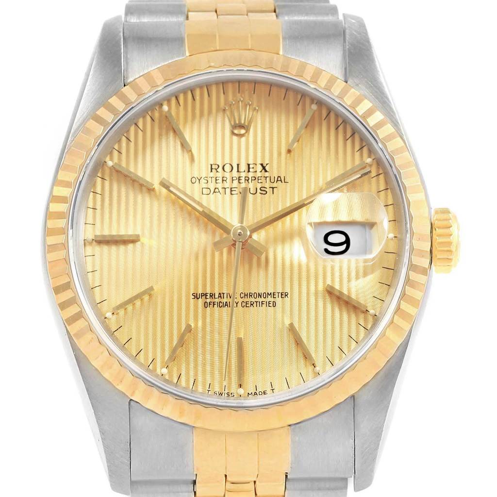 This image shows the face, bezel, and part of the bracelet of a Rolex Datejust 16233 Men's Steel and Gold (two tone) Champagne Dial 16233 Men's Steel and Gold (two tone) Champagne Dial watch in a front-facing angle.